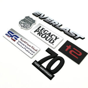 automotive emblem materials metal vs plastic comparison