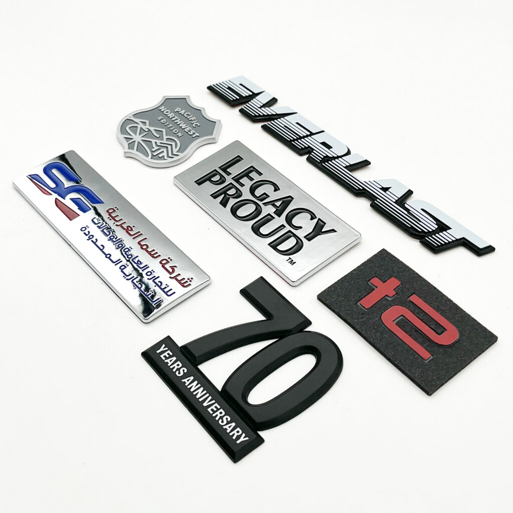 chrome emblems for cars and cool chromed metal emblems on a white background